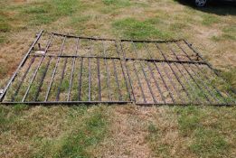 A pair of large and imposing wrought iron driveway gates and hinges, 7 ft high at hinge ends,