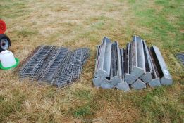 A quantity of galvanised chicken feeders with mesh fronts.