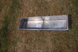 A Stainless Steel trough.