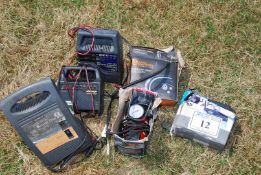 A Halfords tyre inflator, air compressor, mini compressor, and three battery chargers.