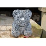 A concrete teddy bear, 14'' high.