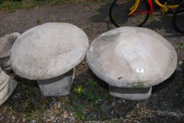 Two concrete toadstools.