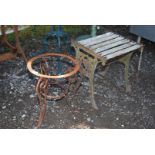 A small cast iron end table having Elephant ends and scroll base frame for a circular table,