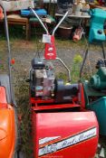 A 45 Rover cylinder mower and a grass box.