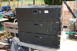 Three industrial stacker drawer units.