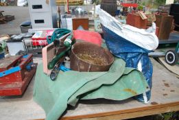 A tray of croppers, cast iron pot, sheet and a bag of rope.