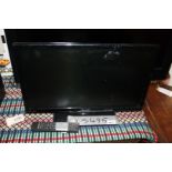 A 21" Celcius flat screen TV with remote.