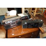 A Roberts RS100 radio/cassette recorder and Saisho portable stereo radio system.
