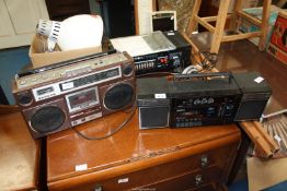 A Roberts RS100 radio/cassette recorder and Saisho portable stereo radio system.