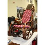 A Bentwood rocking chair with seat and back pad.