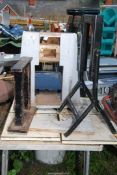 Two metal stands and a press former jig.