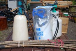Three knapsack sprayers (one as new) and a bundle of drain rods.
