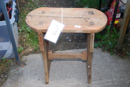 A small wooden table/stool.