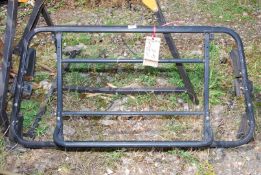 A boot rack for a MGF with lock.