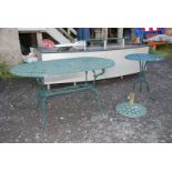 A cast circular table 55'' wide x 32'' deep x 28'' high,