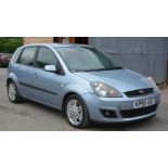 A Ford Fiesta Ghia 1,388 cc petrol-engined five-door hatch-back motor car in blue.