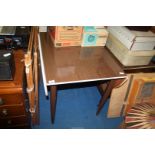 A drop leaf Formica kitchen table.