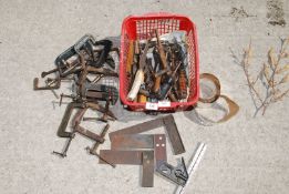 A red tray of set squares and a quantity of small 'G' clamps.