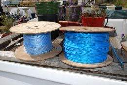 Two rolls of blue nylon rope.