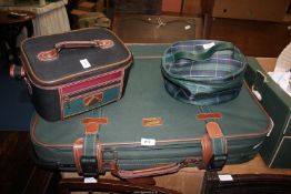 A Carrylite suitcase, Constellation vanity case and one other.