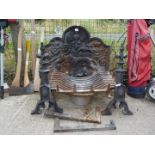 A cast iron Fireback depicting lion with thistle fleurs de lys and rose emblems plus Fire dogs and