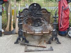 A cast iron Fireback depicting lion with thistle fleurs de lys and rose emblems plus Fire dogs and