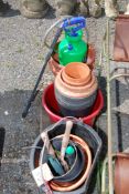 A quantity of plastic and terracotta pots, garden forks and small sprayer.