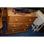 A pine chest of three drawers, 30" x 16" x 30" high.