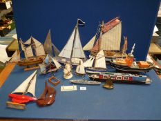 A quantity of model boats made of wood,glass, horn and brass, sailing dinghy,canal boat etc.