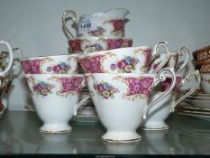 A Royal Standard Teaset for six (no teapot) with floral panels and pink and gilt borders.