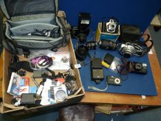 A quantity of cameras and lenses including Canon EOS 1000F, Pentax, Sigma 70 -300 mm F4 - 5.