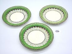 Three unusual pearl ware plates with pierced borders highlighted in green, probably Leeds,