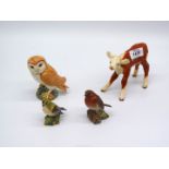 A Beswick Robin, 3" tall, Goldcrest and a large Tawny owl, 4 1/2" tall, plus a Hereford calf,