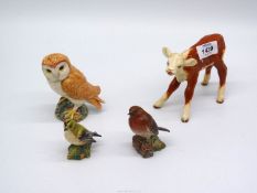 A Beswick Robin, 3" tall, Goldcrest and a large Tawny owl, 4 1/2" tall, plus a Hereford calf,