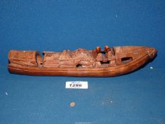 A Chinese Bamboo carving of a boat, 10 3/4'' long x 2 1/2'' tall.