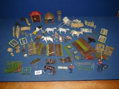A quantity of Britains lead garden pieces including summer house, flower beds, fencing etc.