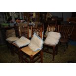 An appealing set of seven bobbin turned backed Dining Chairs in mixed woods and including five
