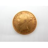 An 1858 Victoria Gold sovereign, 7.88gm.