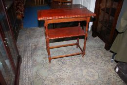 A 1930/40's red Oak flapover Card Table having turned legs and scalloped edged to the surfaces,