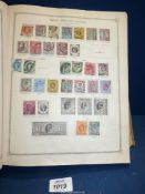 A green Stanley Gibbons 'Ideal' Stamp Album; Part I - B.E.C.