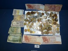 A quantity of foreign coins and notes including Bangladesh, Tanzania, Greece, Spain, France, etc.