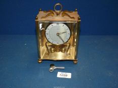 A Koma Anniversary clock with key.