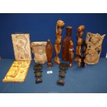 A quantity of treen including Buddha, The Virgin Mary, African lady holding shield, etc.