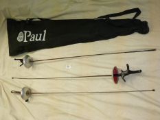 Three Fencing swords in a black case.