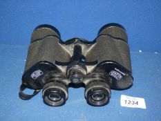 A set of Carl Zeiss Jena Jenoptem 10 x 50 binoculars with lanyard, small screw missing a/f.
