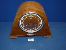 A Smiths Enfield Mantle clock having Arabic numerals, with pendulum, 12" wide x 8 3/4" high.