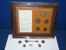 A framed set of five antique coins to include George II shilling, William & Mary farthing, etc.