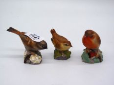 Three Royal Worcester bird ornaments including Robin, Wren and Hedge Sparrow, all a/f.