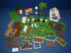 A quantity of Britains plastic garden pieces.