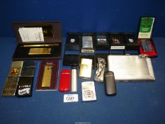 A quantity of cigarette lighters including Zippo souvenir of Falklands, Wales, Canada etc,